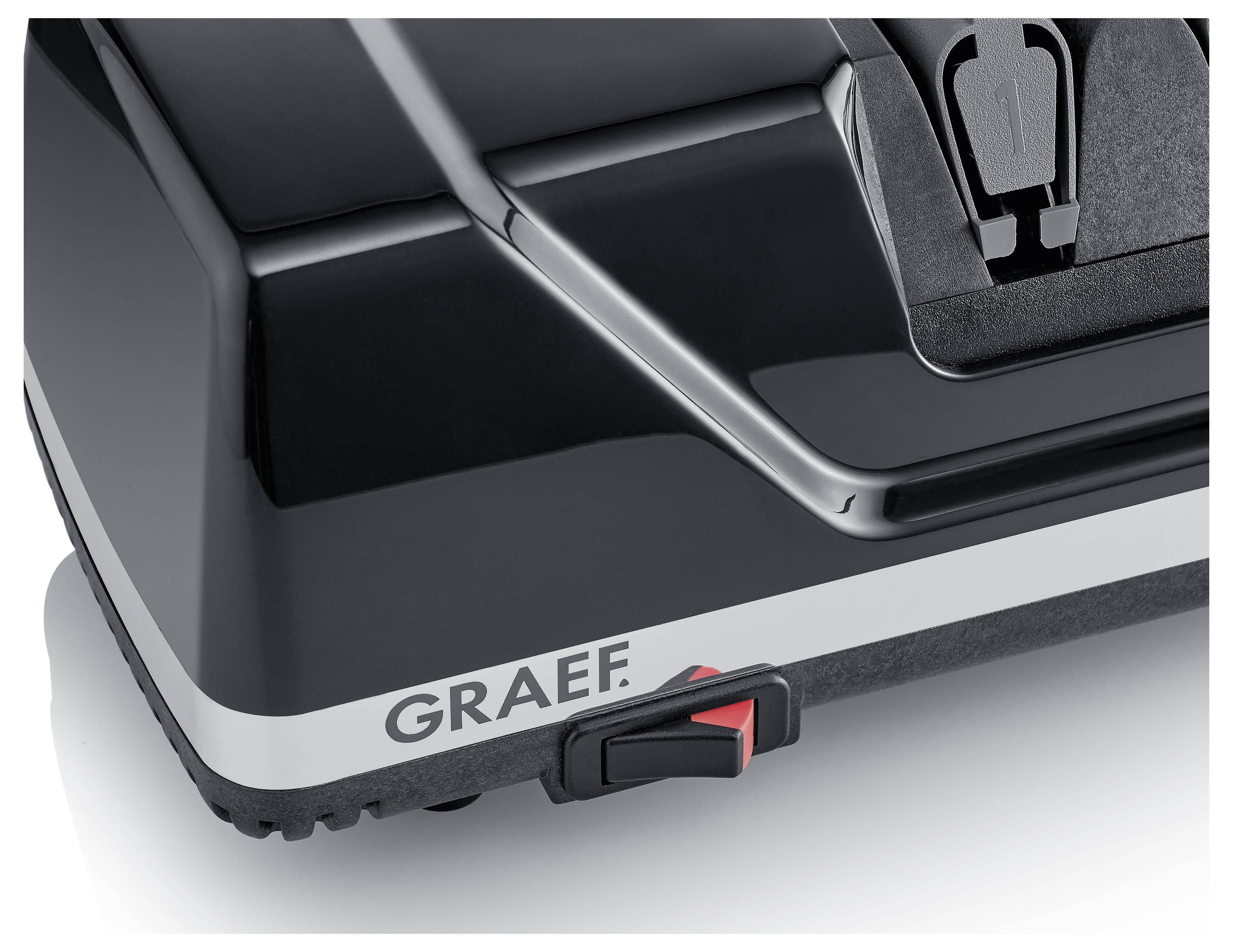 Zwarte Graef messenslijper met een rode aan-uitschakelaar, voorzien van strakke designelementen en een mesgleuf aan de bovenkant.