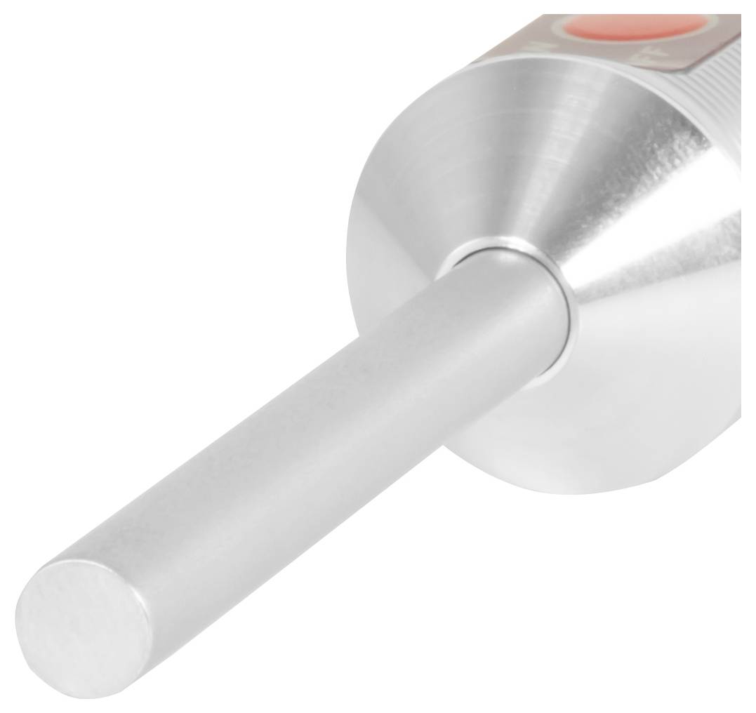 Close-up van een zilverkleurig metalen cilindrisch apparaat met een lange staaf die uit de voorkant uitsteekt en een rode knop op de bovenkant.