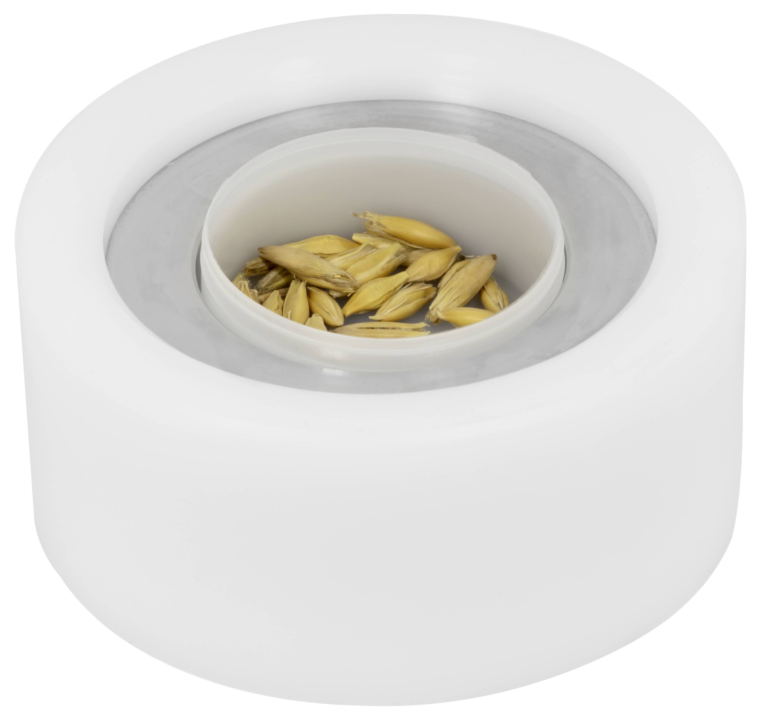 Witte ronde container met een ingezonken kopje waarin een kleine hoeveelheid taan gekleurde graanzaden.