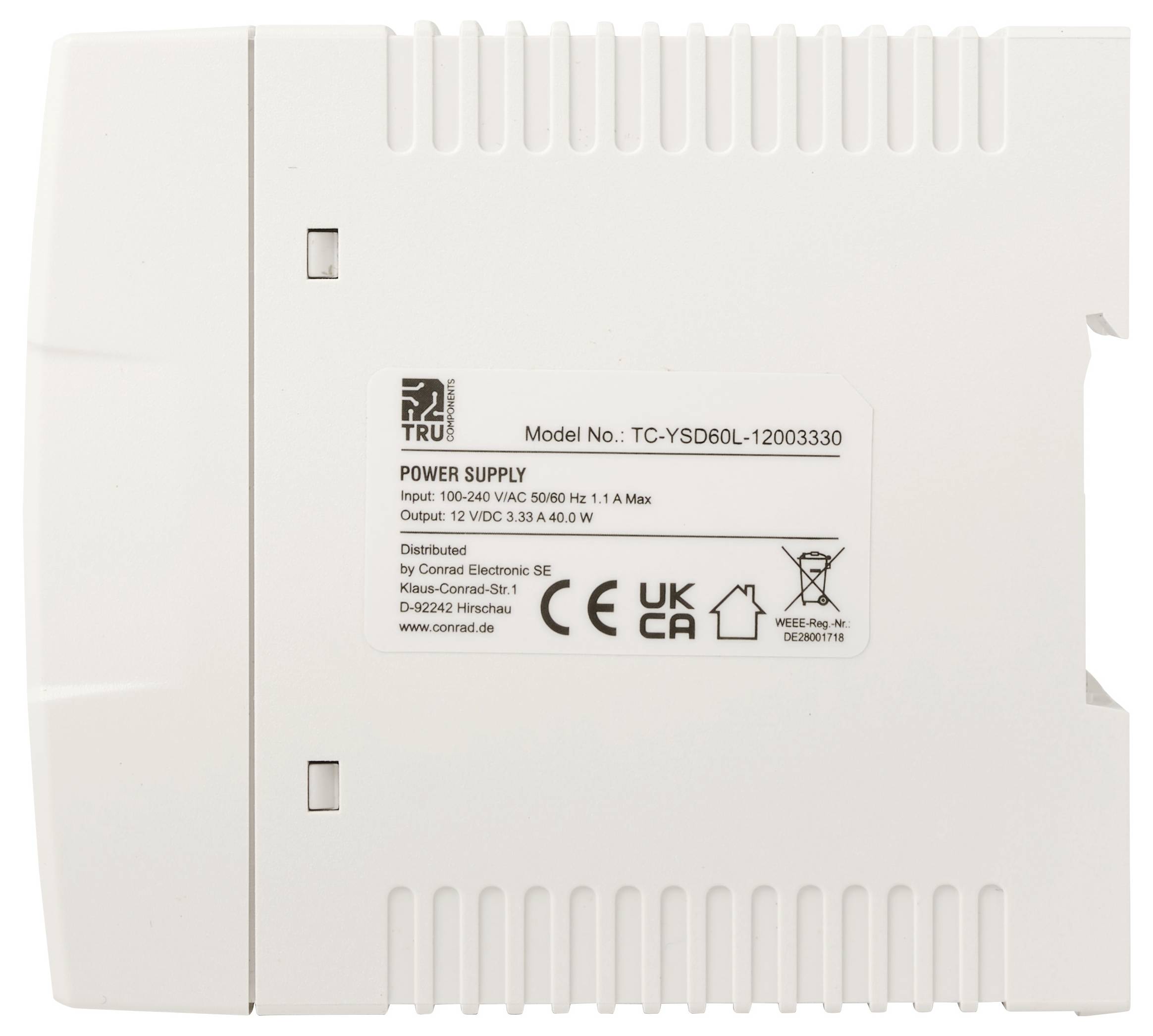 Witte rechthoekige voedingseenheid met label 'TRU' en 'Model Nr.: TC-YSD60L-12003330', met input- en outputspecificaties afgedrukt op het middensticker.