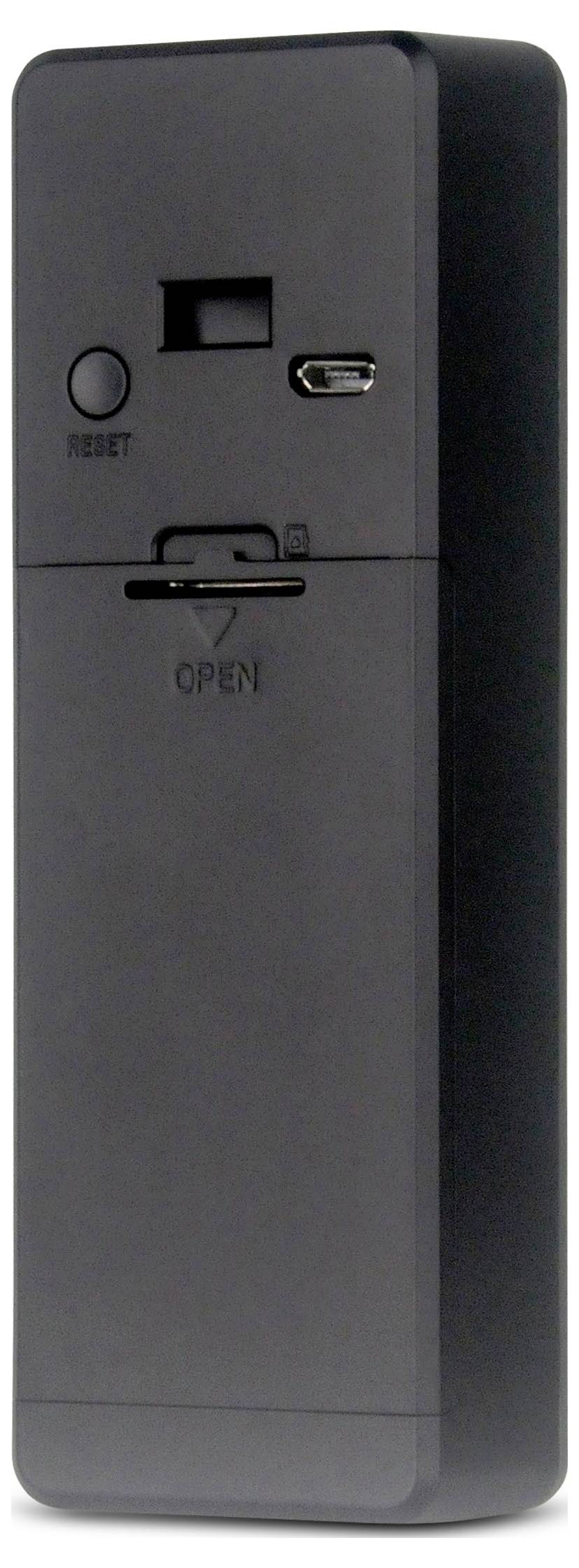 Een donker elektronisch apparaat met een resetknop, USB-poort en een compartiment met het label 'OPEN'.