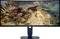 'Alienware-monitor met 'Warhammer 40.000: Space Marine II'-spel met een gedetailleerde gevechtsscène met grote wezens op een strand.'