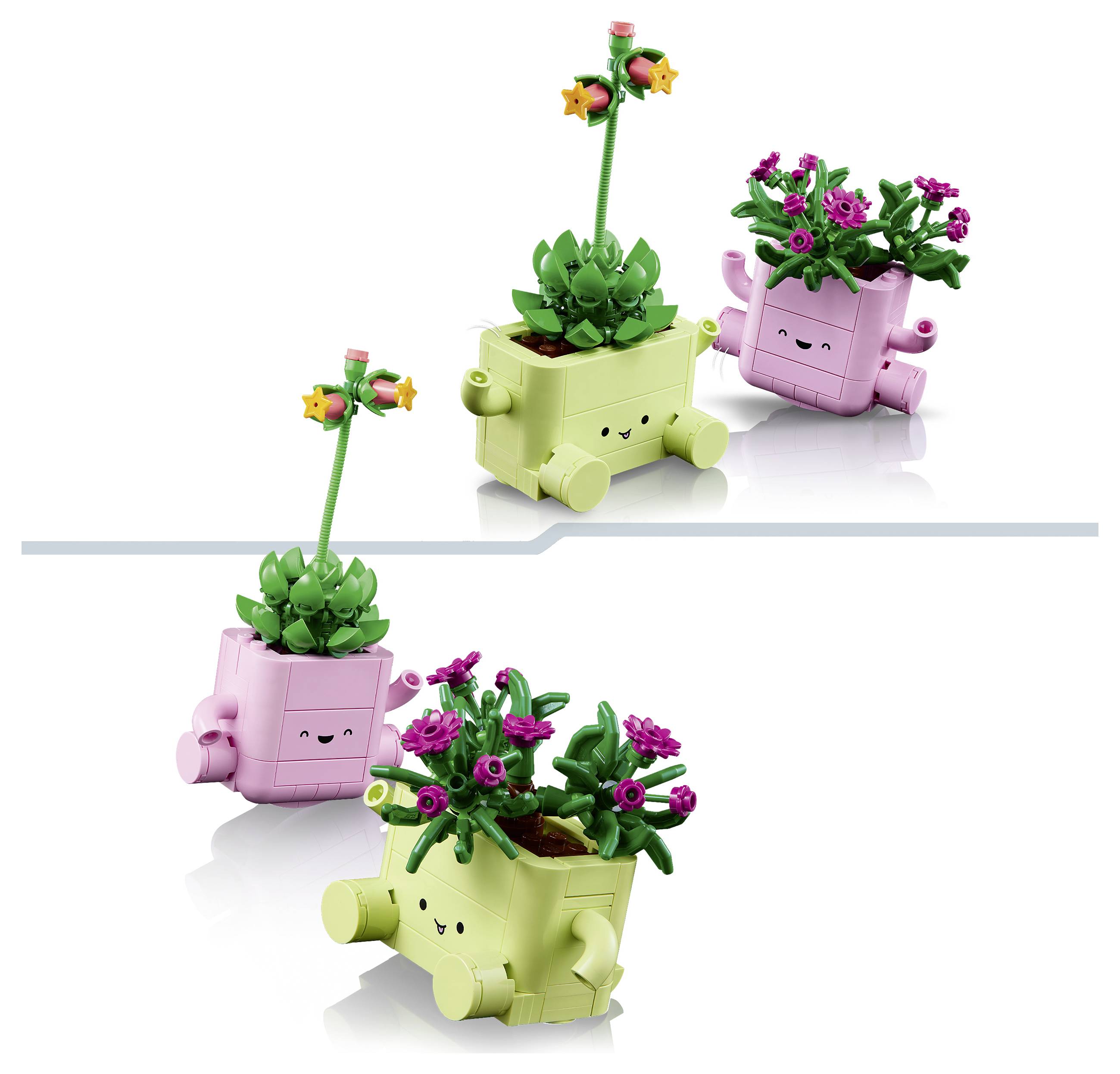 Twee LEGO-achtige glimlachende plantenbak-figuren in roze en limoengroen, elk bekroond met bloemen en bladeren, weergegeven in twee poses op een witte achtergrond.