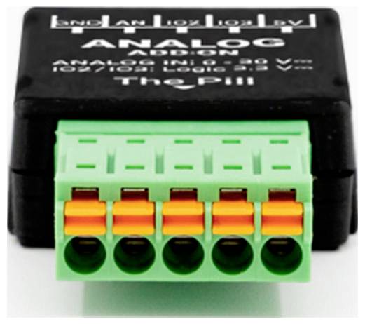 'The Pill' analoog add-on met een groen terminalblok met vijf oranje connectoren gelabeld 'Analog In' voor IOX/IOE gebruik.