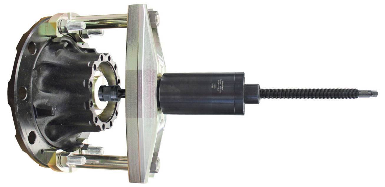 'Een wielnafaftrektool met een cilindrisch zwart onderdeel en vier metalen stangen wordt getoond, gebruikt voor het verwijderen van wielnaaven.'