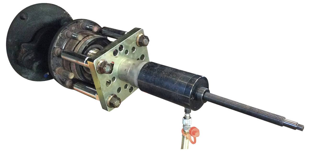 Een cilindrisch mechanisch apparaat met een draadstang die uit een flensbevestiging steekt, gebruikt voor pers- of aandraaitorpassingen.