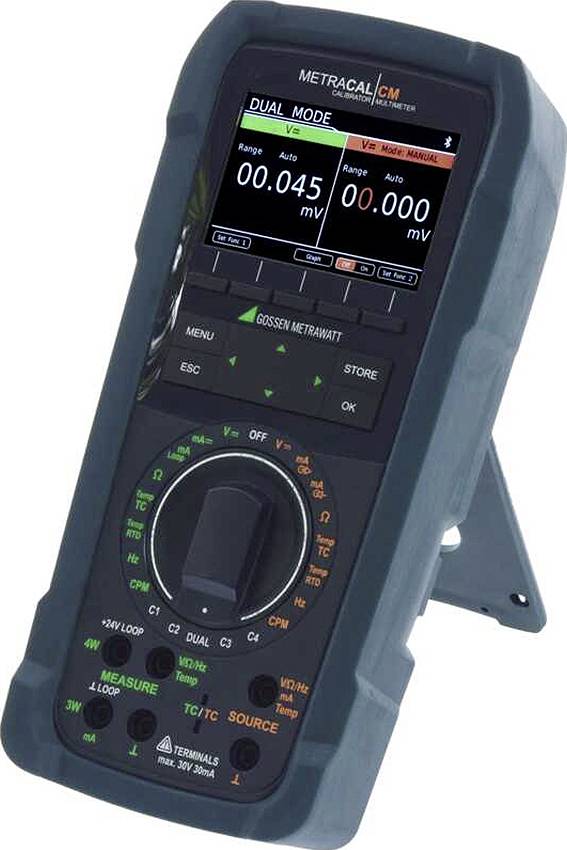Handheld METRAcal CM-kalibrator/multimeter met dual-modus spanningsmetingen op een digitaal display.