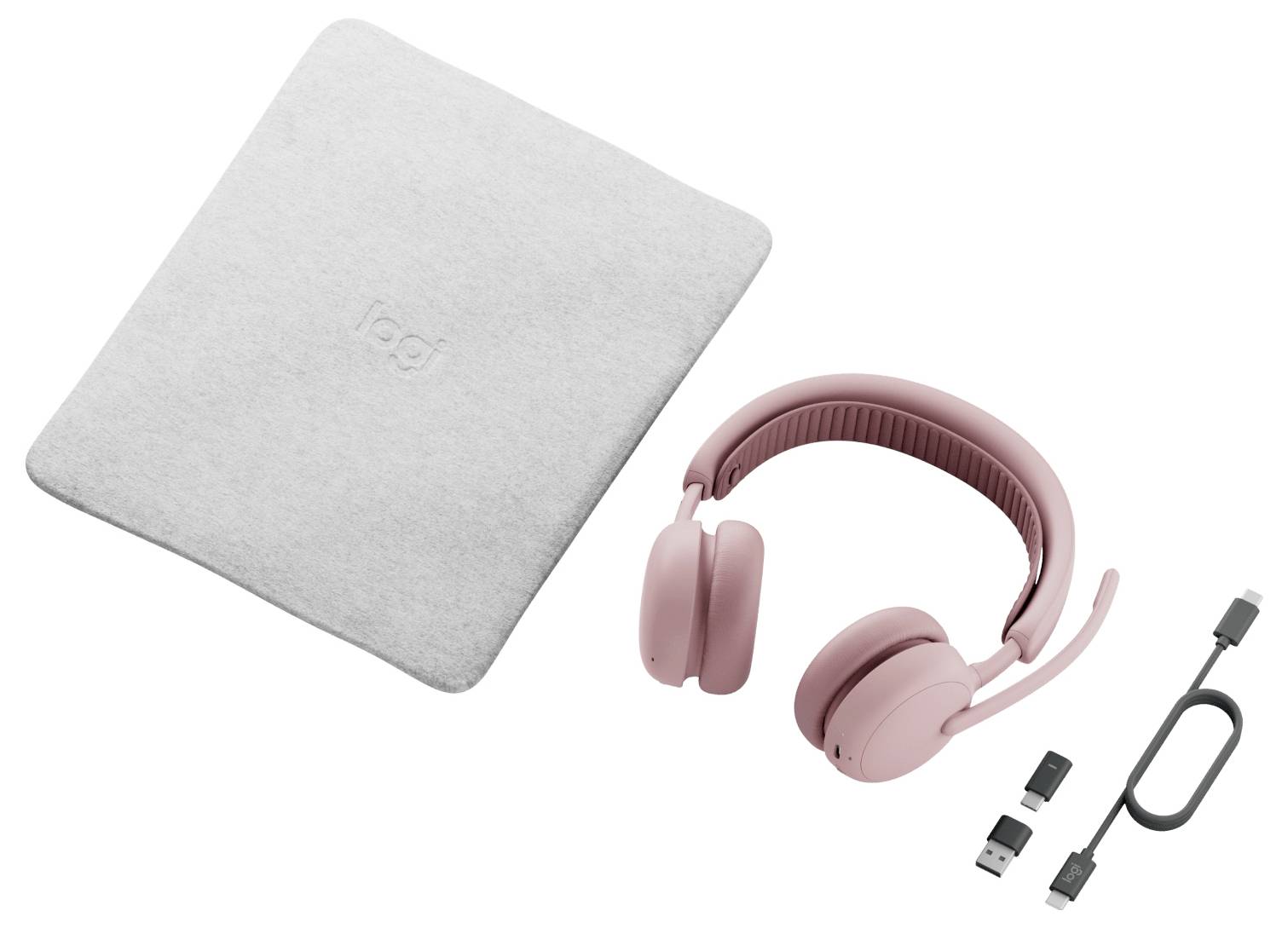 Roze over-ear koptelefoon met USB-C-kabel en adapter naast een grijze draagtas, weergegeven als productset op witte achtergrond.