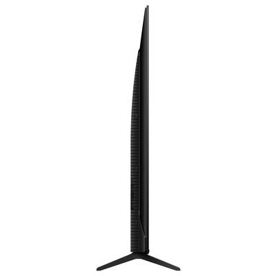 Een zijkant van een modern, ultradun televisietoestel met standaard, dat het dunne ontwerp en minimalistische stijl toont.