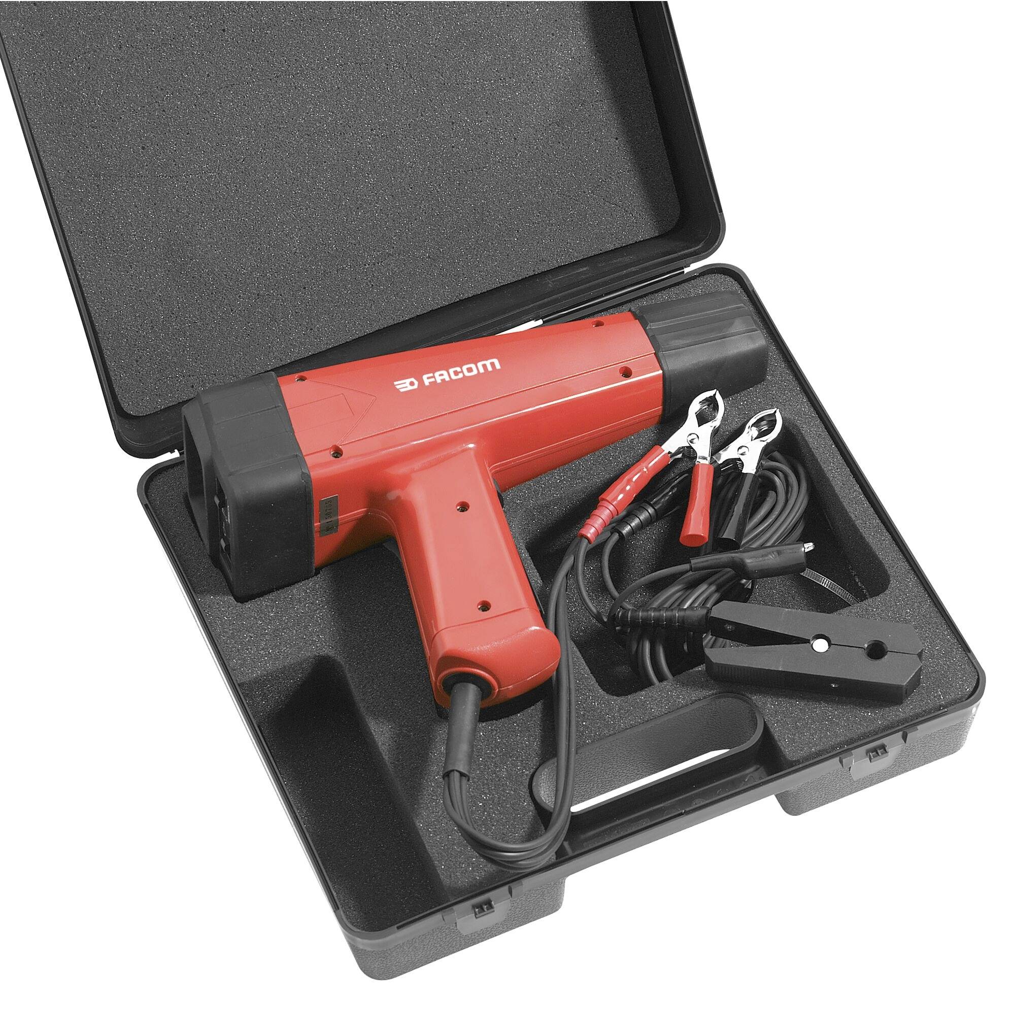 Een rood timingpistool met kabels, geplaatst in een zwarte draagtas, gebruikt voor het afstellen van de motorafstelling in voertuigen.