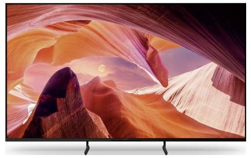 Flatscreen-televisie met een levendige canyonlandschap met roze en oranje rotsformaties en zonlicht.