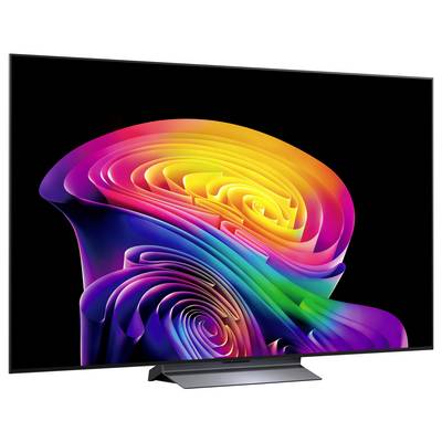 Een flatscreen-televisie toont een levendige abstracte regenboogwervel op een zwarte achtergrond.