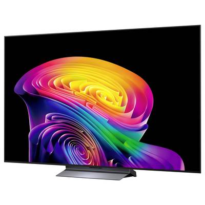 Een flatscreen-tv die een kleurrijke abstracte regenboogspiraal op een zwarte achtergrond weergeeft, getoond op zijn standaard.