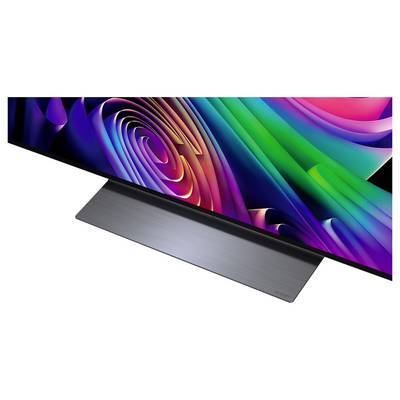 Dun plat scherm met een kleurrijk abstract wervelpatroon als achtergrond, met een geborsteld metalen standaard op een witte achtergrond.