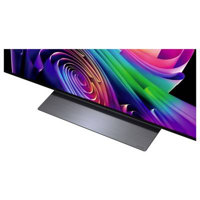 Slank flatscreen-tv met een kleurrijke abstracte wervelweergave op een metalen standaard, weergegeven onder een hoek op een witte achtergrond.