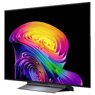 Flatscreen-tv met een levendige abstracte neon wervelende achtergrond op een zwart scherm, geplaatst op een standaard tegen een effen achtergrond.