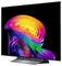 Flatscreen-tv met een levendige abstracte neon wervelende achtergrond op een zwart scherm, geplaatst op een standaard tegen een effen achtergrond.