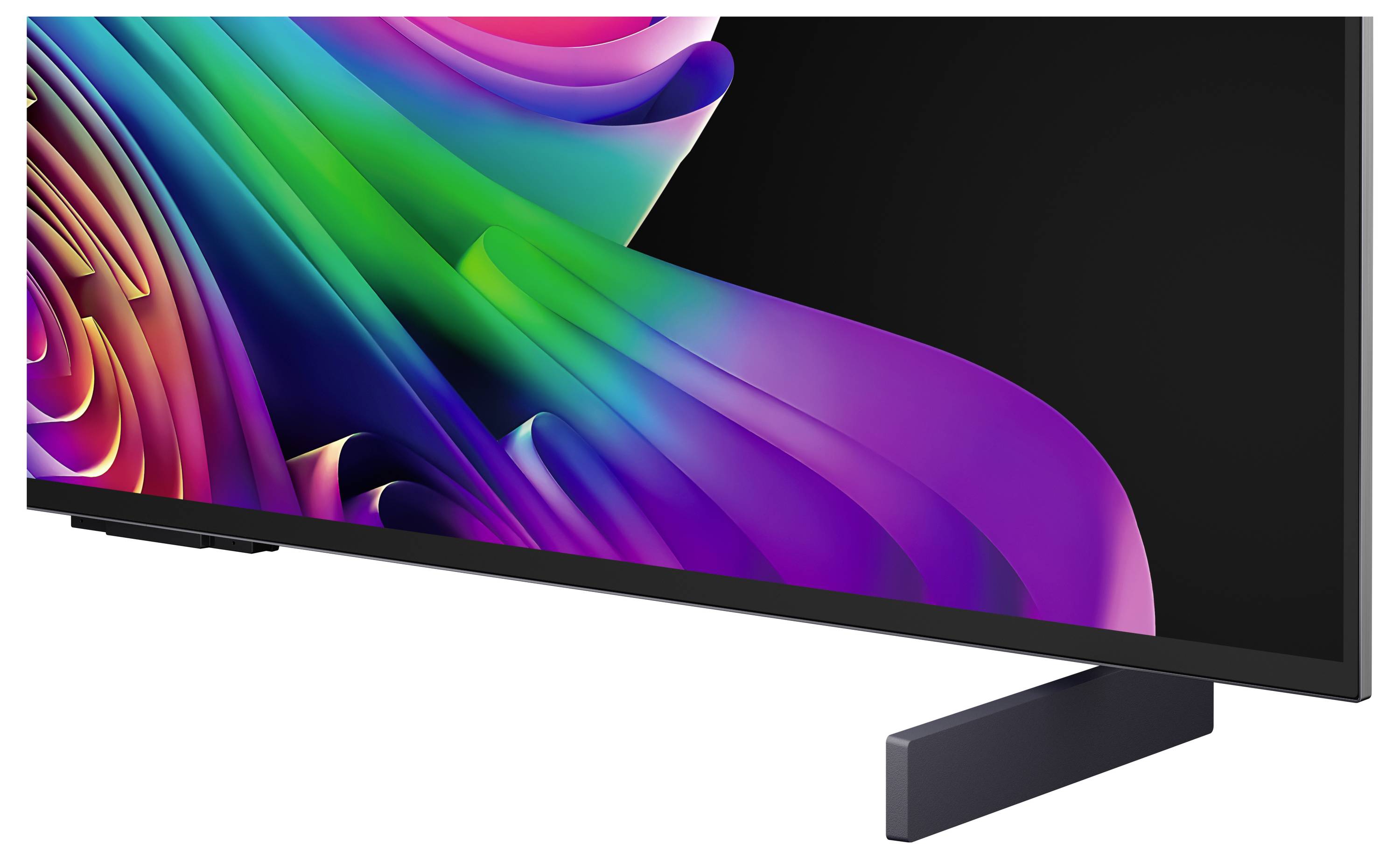 Een breedbeeldtelevisie of monitor die een kleurrijk abstract lintpatroon op een zwart scherm weergeeft, geplaatst op een standaard tegen een witte achtergrond.
