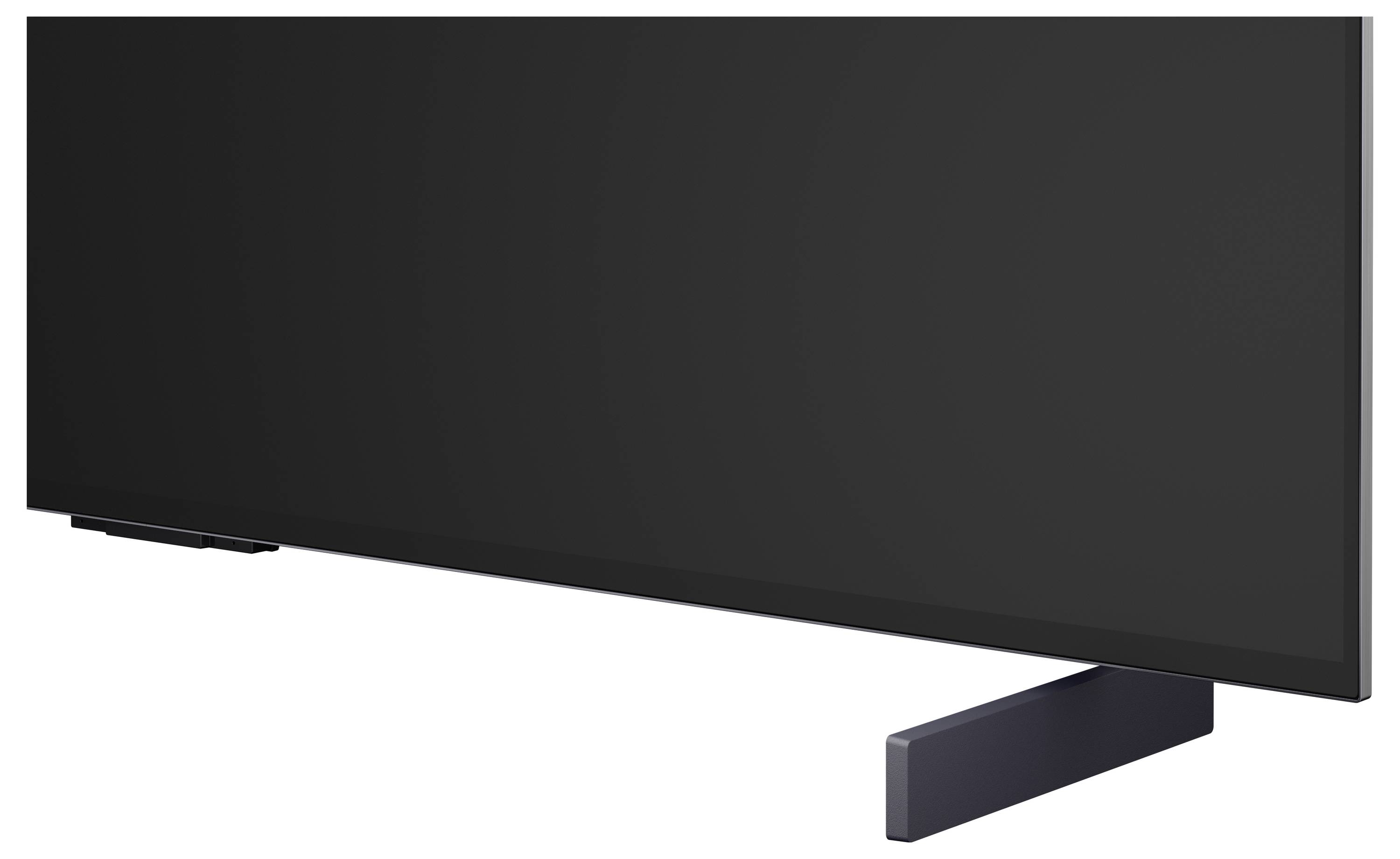Zwarte flatscreen-televisie op een standaard, weergegeven onder een hoek op een witte achtergrond.