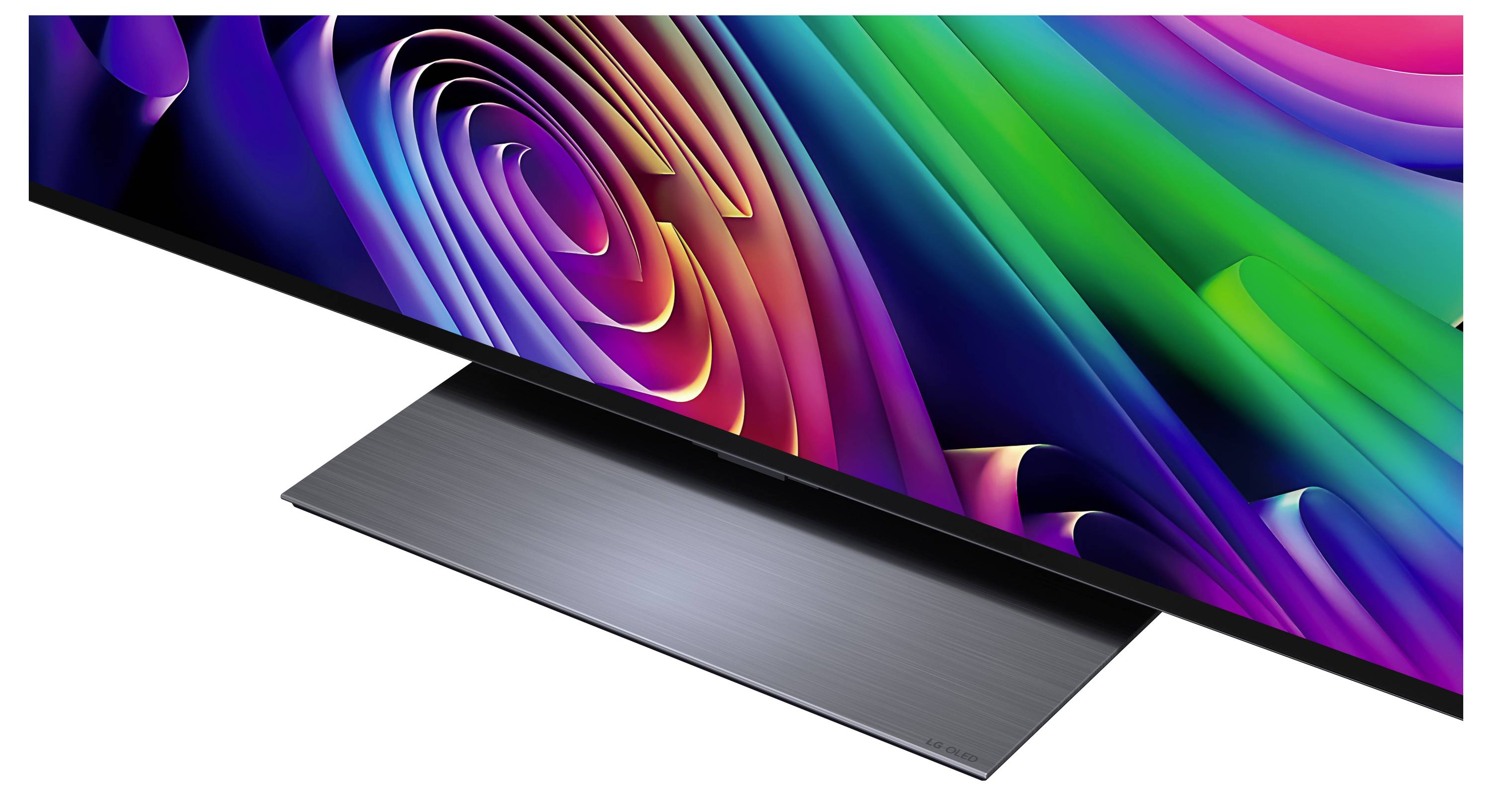 Een kleurrijk abstract display op een slank flatscreen-monitor met een geborsteld metalen standaard, weergegeven in een schuin zijzicht op een witte achtergrond.