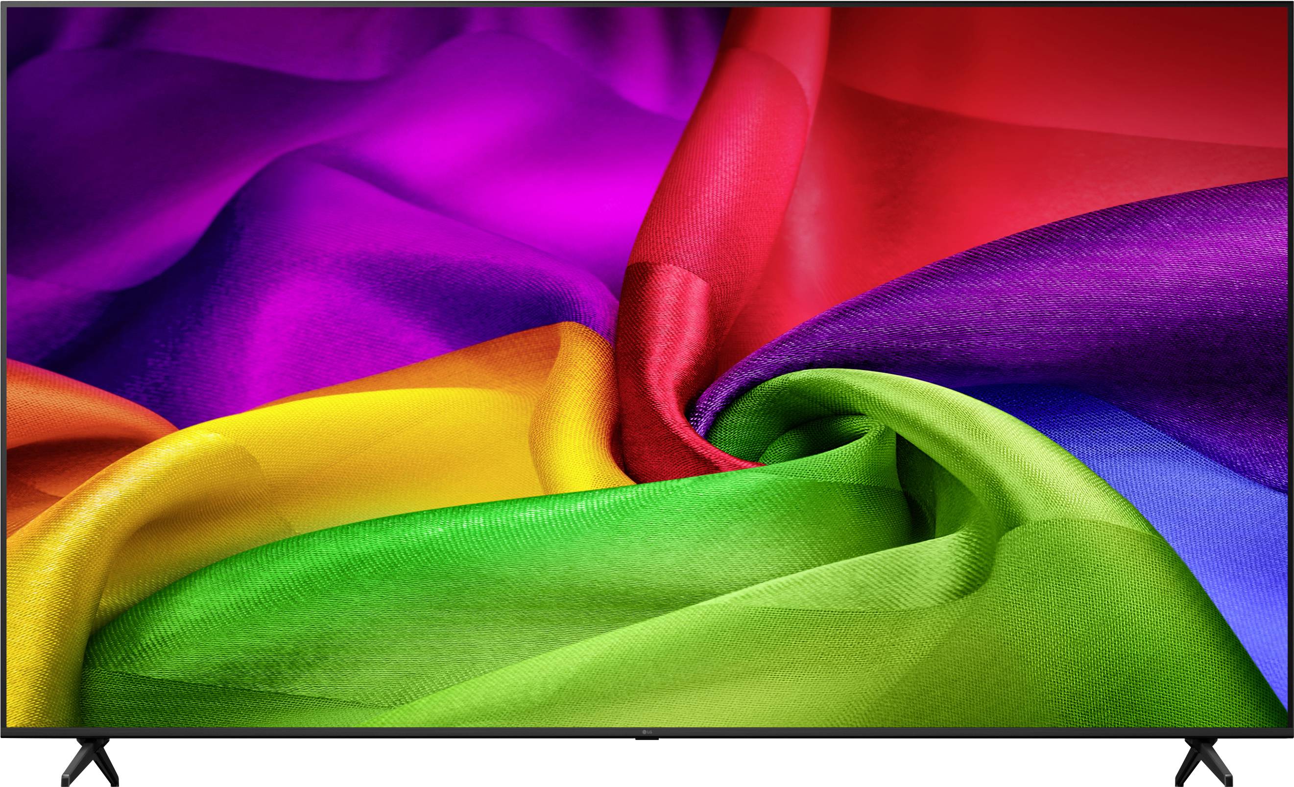 Close-up van een flatscreen-televisie die een levendig abstract beeld toont van kleurrijke zijdeachtige stoofplooien in regenboogkleuren.