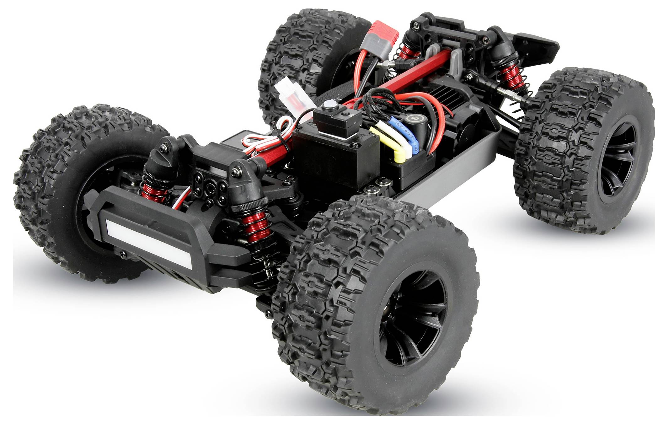 Afstandsbediende off-road buggy chassis met vier grote knobbelige banden en zichtbare ophanging, weergegeven op een witte achtergrond.