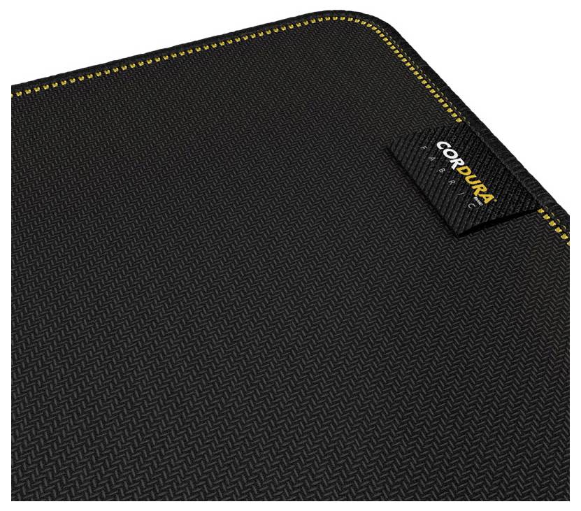 Zwart gestructureerd Cordura-stof close-up met geel gestikt randje en een klein 'CORDURA' labeletiket.