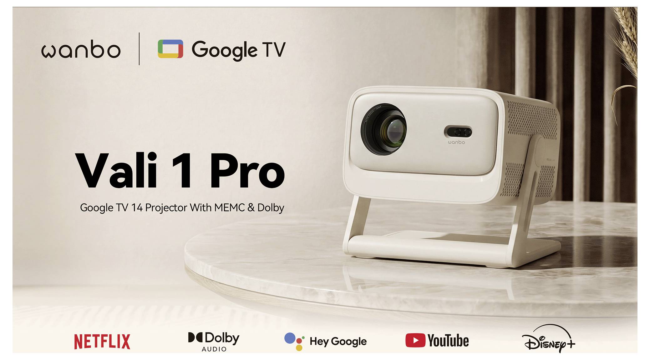 Promotionele banner voor Wanbo Vali 1 Pro Google TV-projector, waarbij de projector op een tafel wordt getoond met logo's voor Netflix, Dolby Audio, Hey Google, YouTube en Disney+.