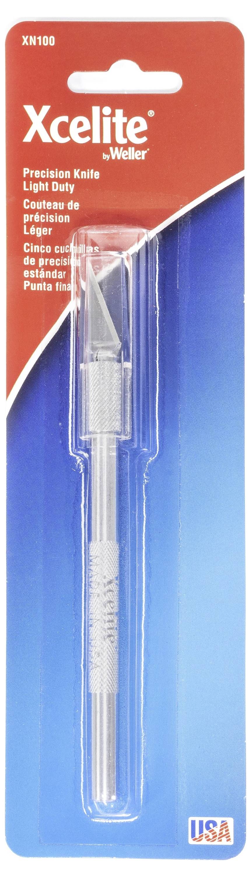 Pakket met Xcelite by Weller precisie-mes met licht-duty lemmet, weergegeven in doorzichtige kunststof doos op rood en blauw verpakking, gemarkeerd USA.