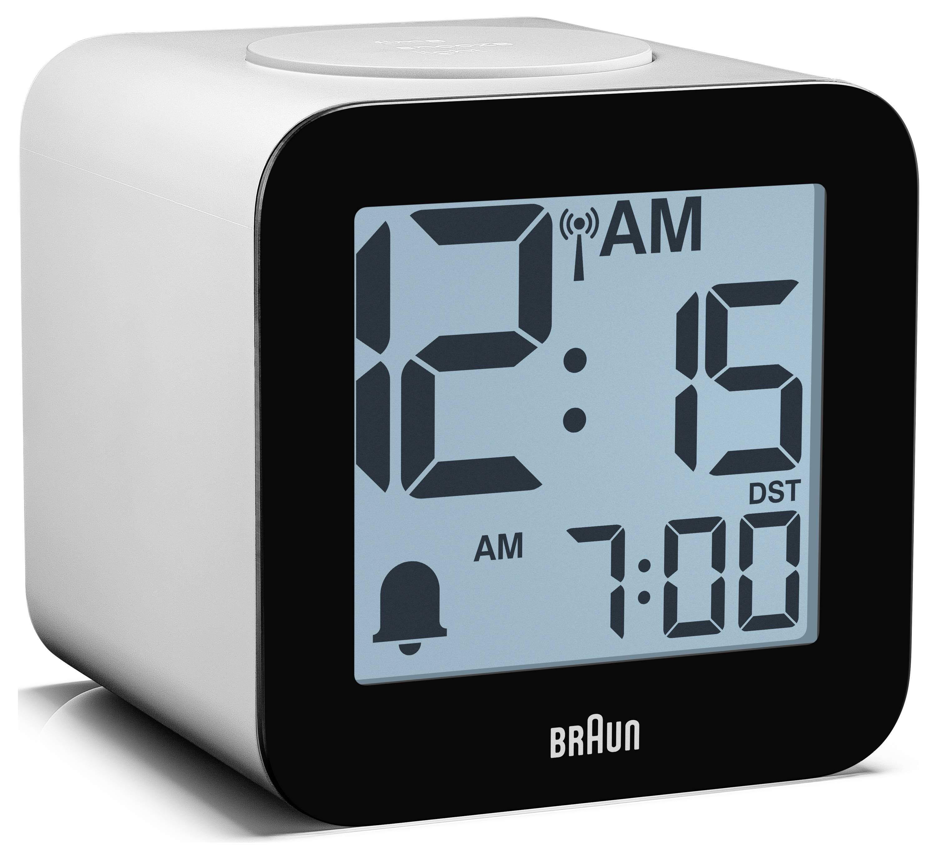 Digitale Braun wekker met weergave van 12:15 AM met alarm ingesteld op 7:00 en zomertijdaanduiding.