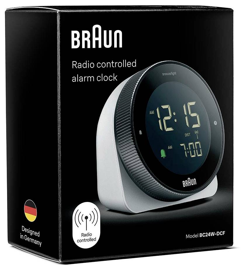 Braun radiogestuurde wekker op productdoos, model BC24W-DCF, met digitaal display dat 12:15 en 7:00 aangeeft.
