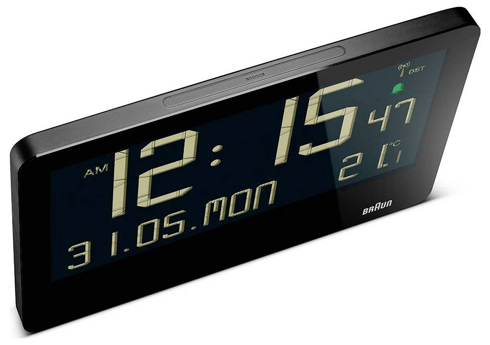 Zwart Braun digitaal wekkerradio toont 12:15 AM, maandag 31.05, 21°C, met een zomertijdindicator.