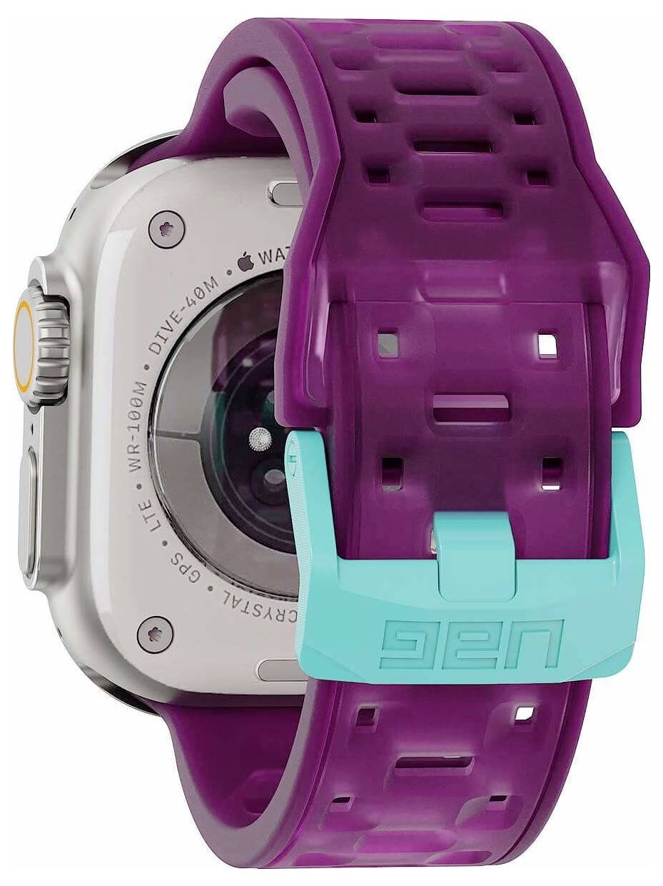 Apple Watch met een paars doorschijnend bandje en turquoise sluiting, getoond in close-up op een witte achtergrond.