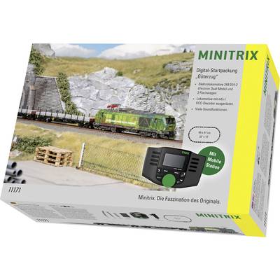 Productdoos voor MINITRIX digitaal startset met groene locomotief die vrachtwaggons trekt, met spoor, controller en 'Mit Mobile Station'-etiket.