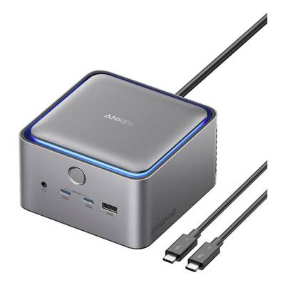 Anker Prime-bureauoplader met gloeiende blauwe rand, frontale aan/uit-knop en USB-C/USB-A-poorten, weergegeven met aangesloten oplaadkabels.