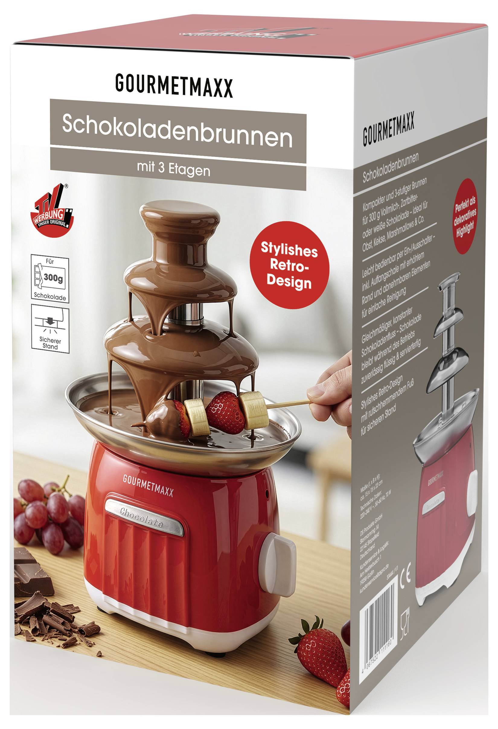 GOURMETMAXX Chocoladefontein verpakking met een rode chocoladefontein met 'Chocoladefontein' en 'met 3 Etagen', plus een rood embleem met 'Stijlvol Retro-Design'.