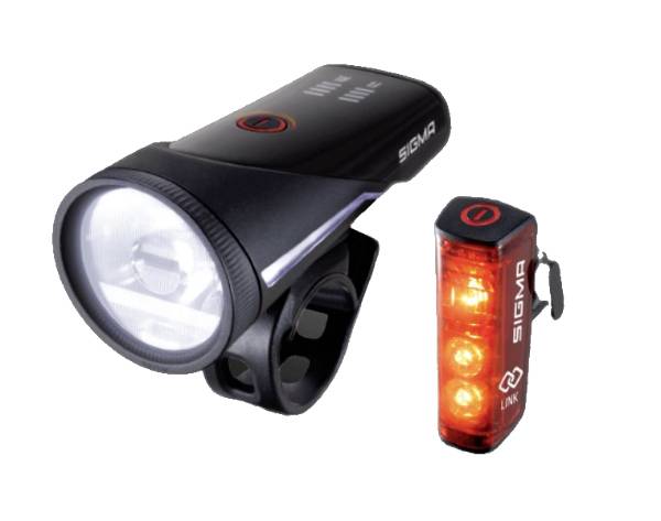 Een fietsverlichtingsset met een witte voorlamp en een rode achterlamp, beide zwart met SIGMA-branding.