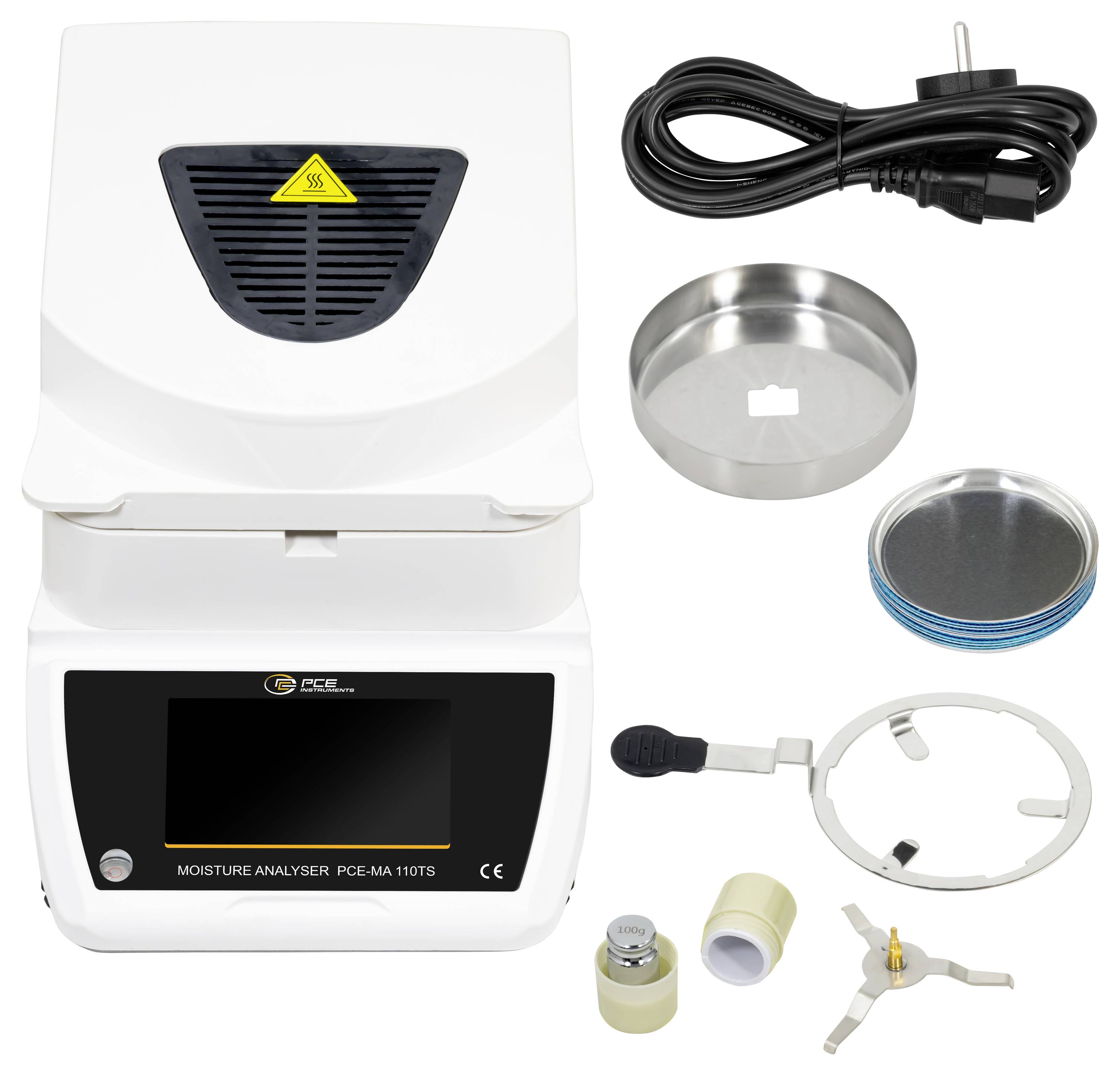 Vochtanalysatorkit met digitale analyseunit, stroomkabel, monsterschaaltjes, adapterring en kleine accessoiredelen.