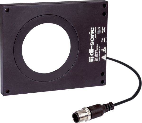 Donkergrijs industrieel sensorsensormodule met een groot circulair opening en een aangesloten kabel eindigend in een metalen connector.