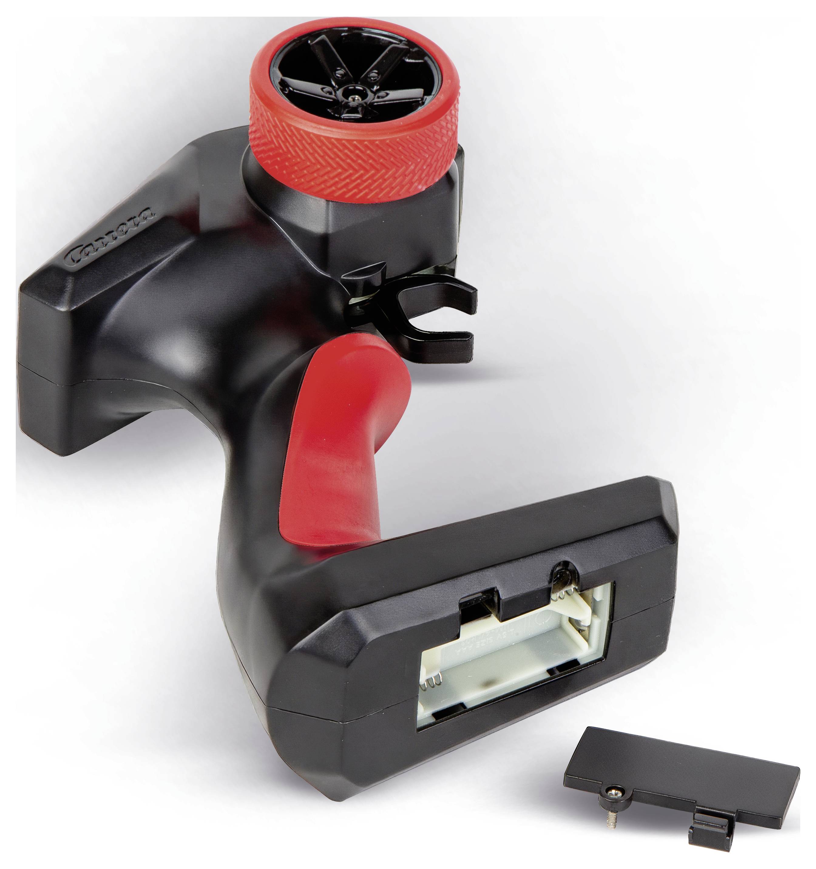 Zwart-rood handheld gereedschap met een gestructureerde bovenkant met schijf en greppeluiting, weergegeven met een klein losgekoppeld dekstukje op een witte achtergrond.