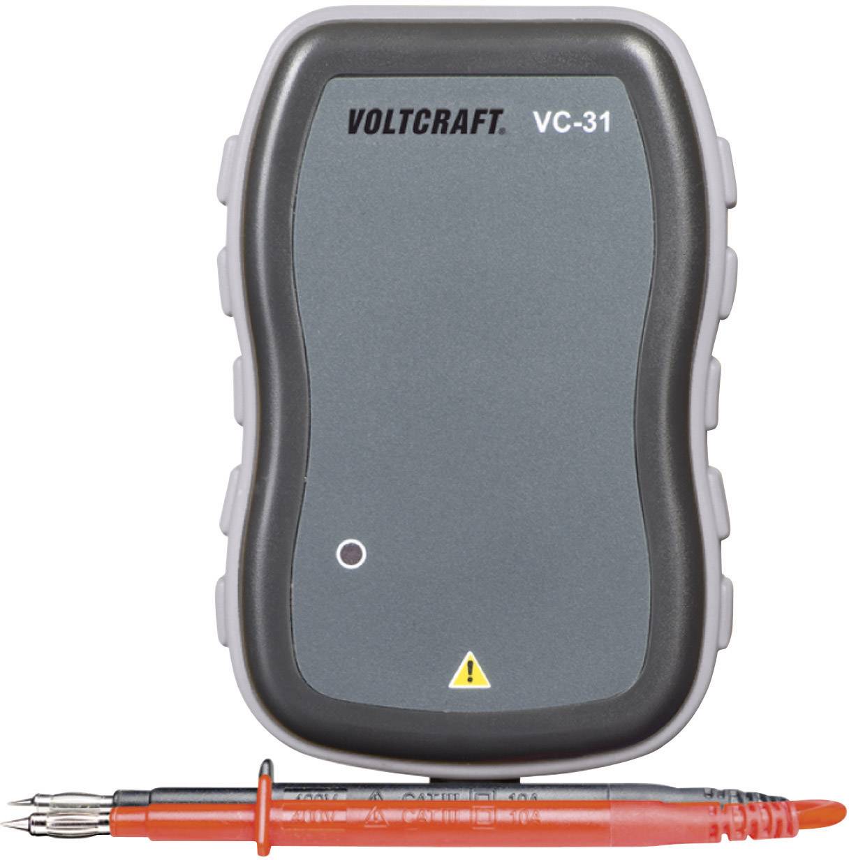 'Voltcraft VC-31 spanningscontroleur' met een grijs behuizing en rode meetkabels.