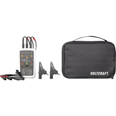 Een elektrische apparaattester van het merk Voltcraft met kabels en klemmen, naast een zwarte transporttas met de opdruk 'VOLTCRAFT'.
