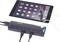 Tablet, verbonden met een USB-hub, toont laad- en verbindingsmogelijkheden voor meerdere apparaten. Scherm toont apps.