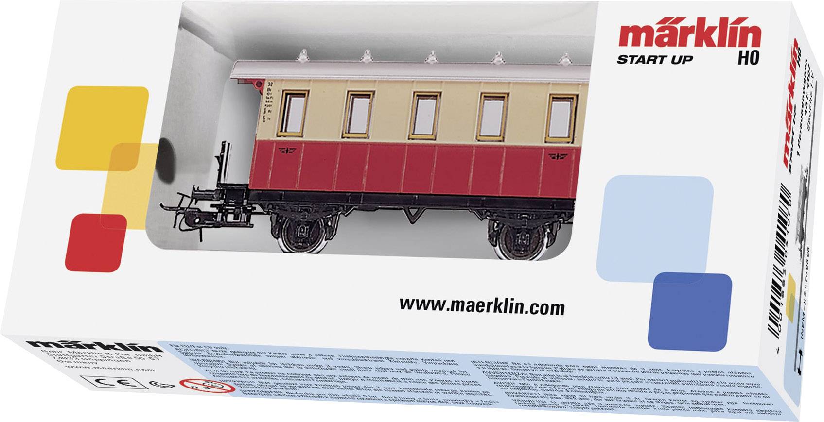 Verpakking van een Märklin H0-modelspoorwagen. Toont een rood-beige wagon in het venster. Merklogo en website rechtsboven.