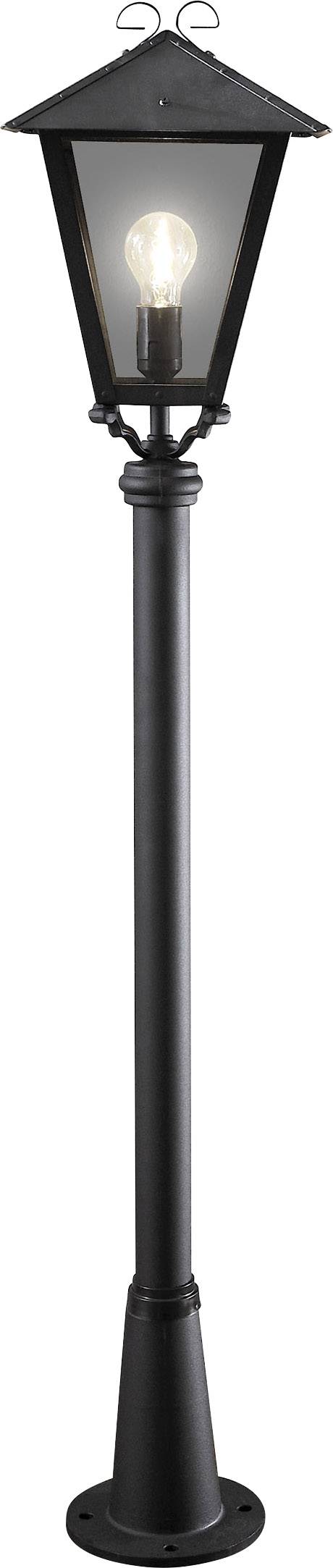 Zwarte, klassieke staande lantaarn met een zichtbare gloeilamp aan de binnenkant, geschikt voor buitenverlichting.