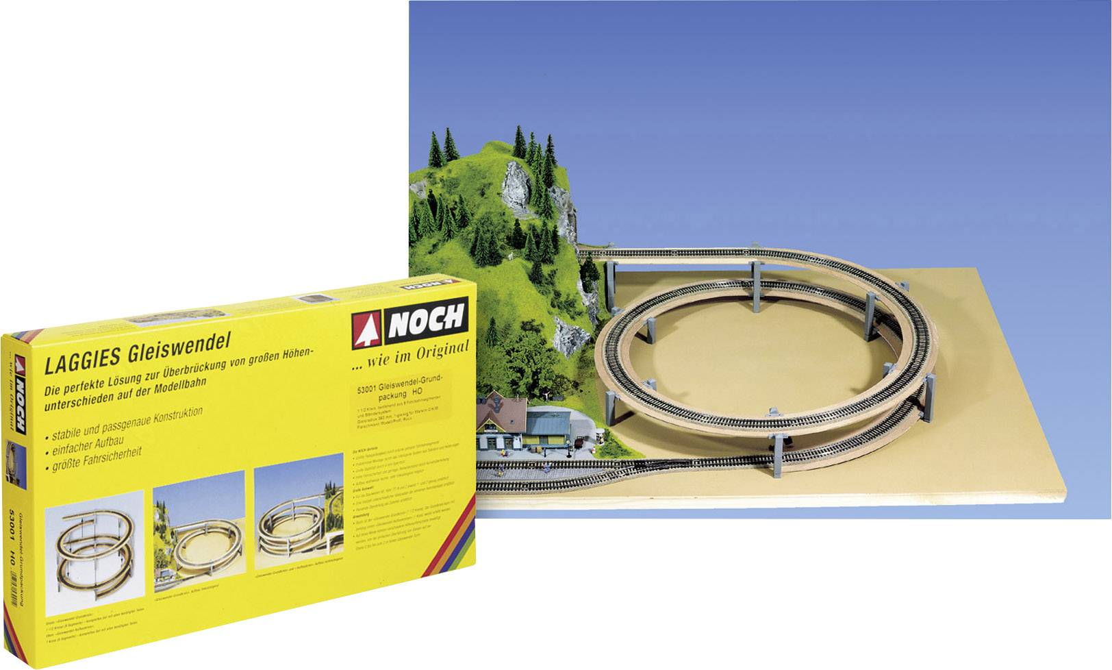 Een modelspoorbaan-set-verpakking naast een opgebouwde spoorbocht op een houten plaat, met landschapsdecoratie en bomen.