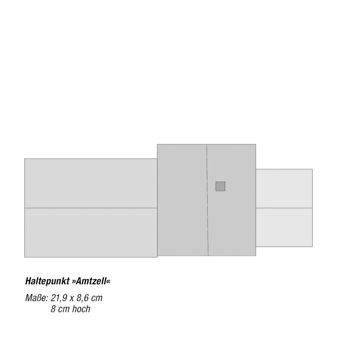 Grijze rechthoekige omtrek met verschillende secties. Tekst 'Halteplaats »Amtzell«'. Afmetingen: 21,9 x 8,6 cm, 8 cm hoog.