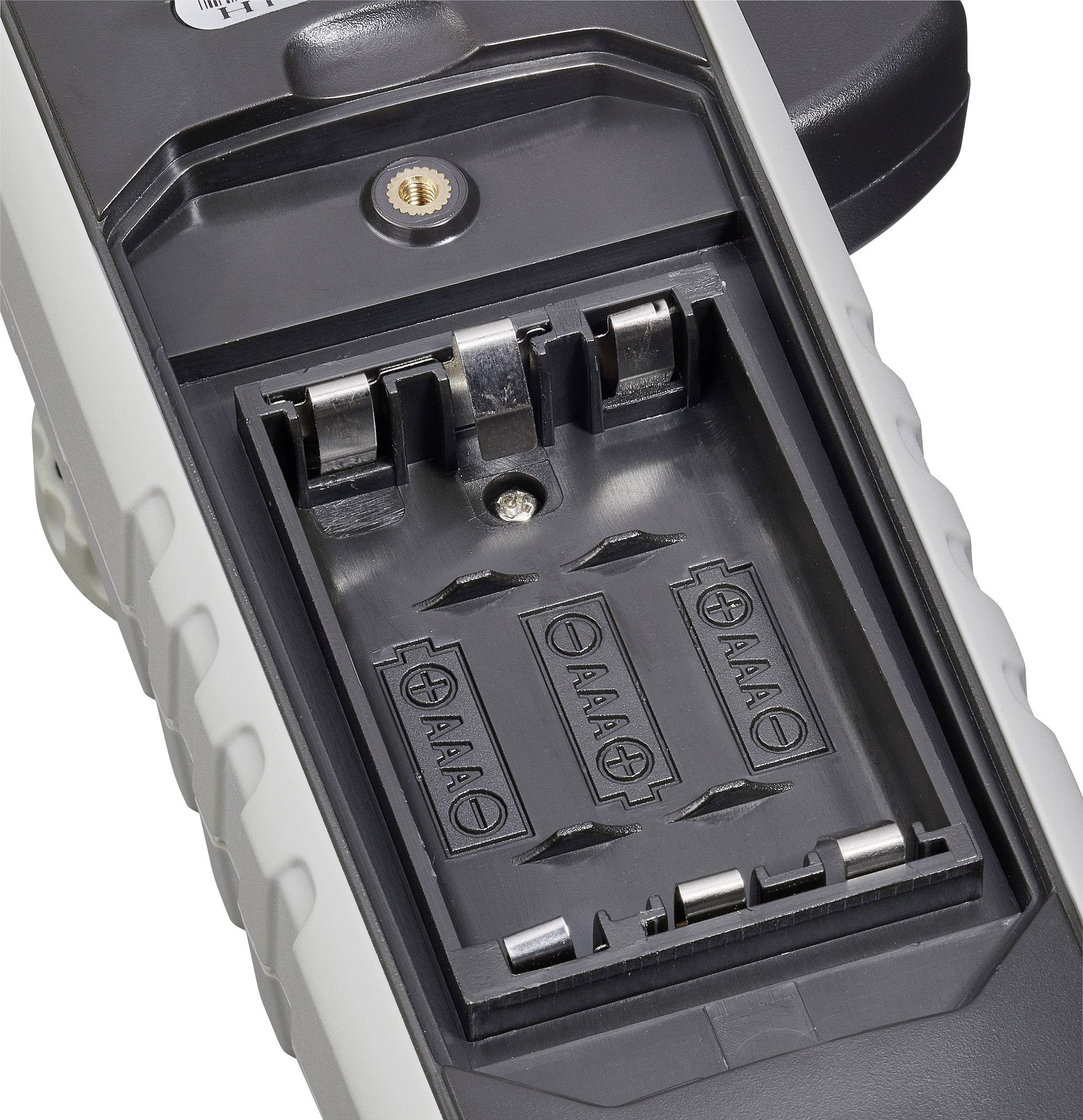 Een batterijvak voor vier AAA-batterijen, zonder geplaatste batterijen. Het vak is open en toont de aansluitklemmen.