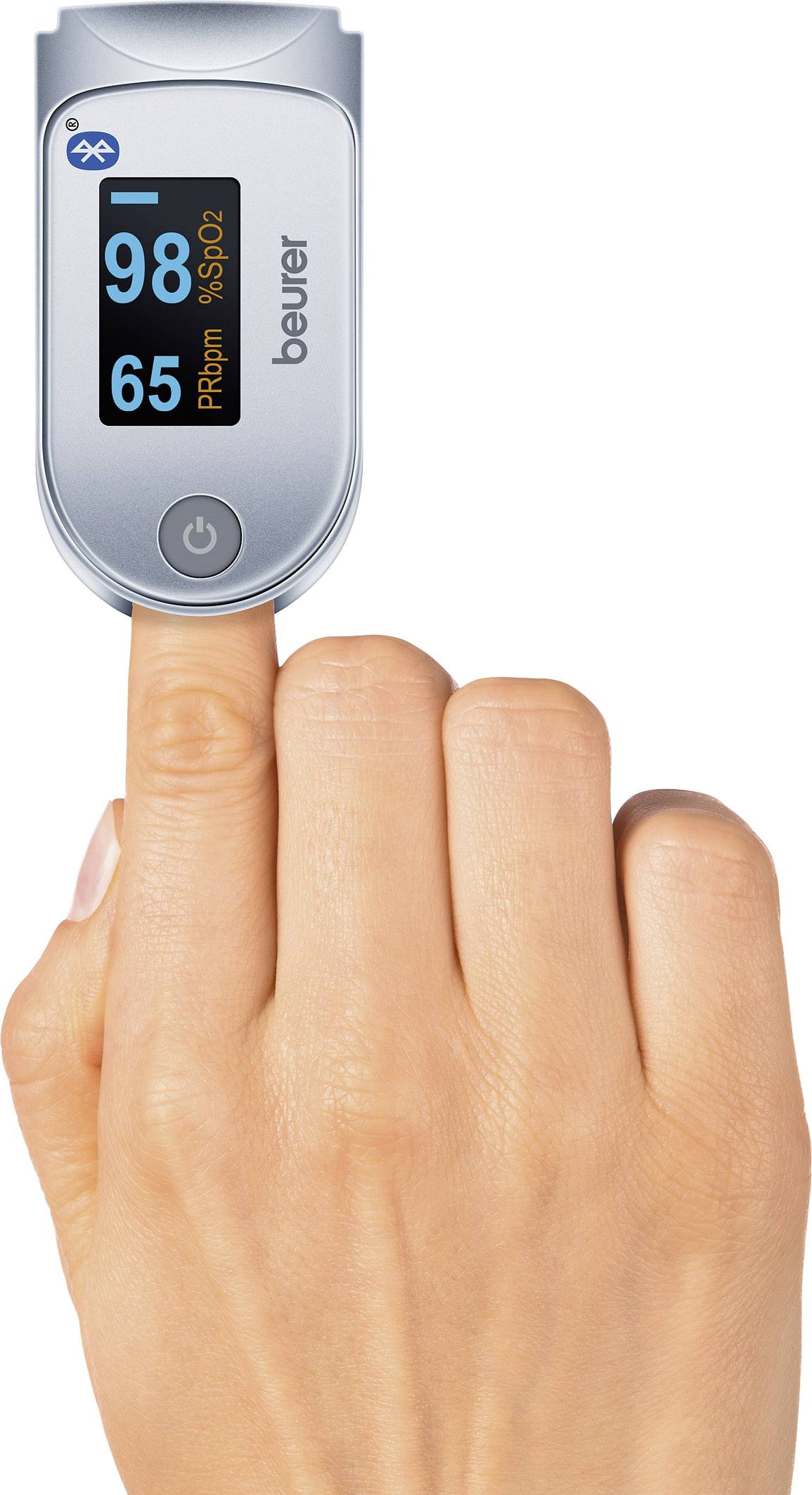 Een vinger draagt een pulsoximeter dat '98 SpO2' en '65 PR bpm' weergeeft. Het apparaat heeft een Bluetooth-symbool op het display.