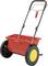 Rode handstrooier met zwarte handgreep en grote, gele wielen. Merk 'Wolf-Garten'. Geschikt voor het strooien van zaden of meststoffen in de tuin.